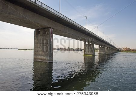 Large Concrete Road Bridge Spanning Large Wide Nile River In Egypt At Kom Ombo