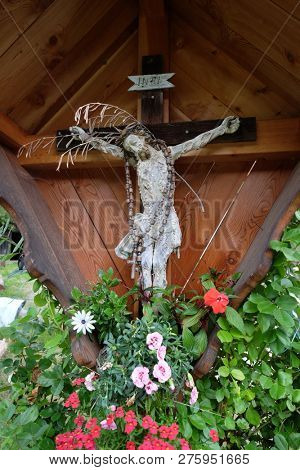 PETSCHIED, ITALY - JULY 14, 2018:Crucifixion in Petschied village near Luson, Northern Italy