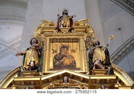 LUCERNE, SWITZERLAND - JUNE 24, 2018: The Virgin Mary with the Child Jesus surrounded by the statues of saints, Saint Nicholas altar in the church of St. Leodegar in Lucerne, Switzerland