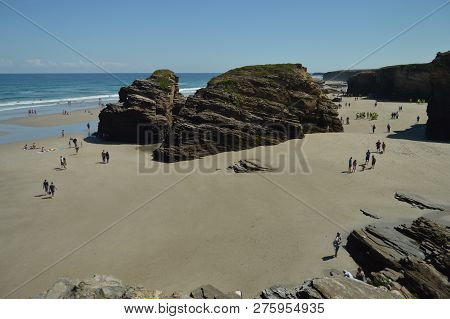 Geological Formations With Hundreds Of Visitors On The Beach Of The Cathedrals In Ribadeo. August 1,