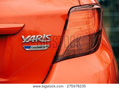 Strasbourg, France - Dec 14, 2018: Reav View Of Red Toyota Yaris Car With France Car Insingnia Meani