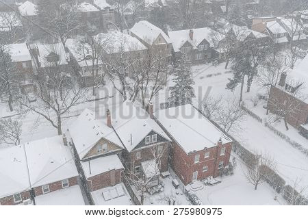 View From Above On Residential Houses And Roofs Covered With Snow During Winter Snow Storm In Toront