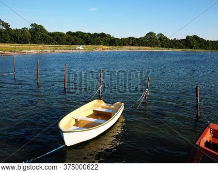 Typical Traditional Colorful Small Danish Fishing Dingy Boat In A Harbour At Funen Denmark