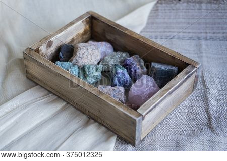 Multi-colored Gems In A Wooden Box. Precious Stones. Collection Of Minerals