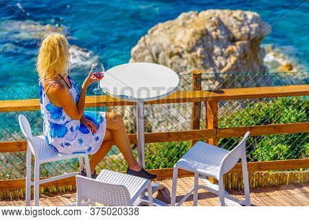 Lifestyle Tourist At Aperitif Drinking A Red Wine Glass And Looking Large Limestone Of Famous Sanson