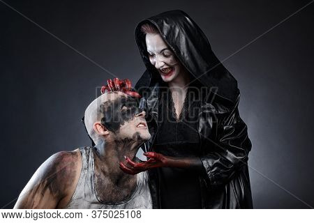 Mad Man And Scary Woman With Blood Hands