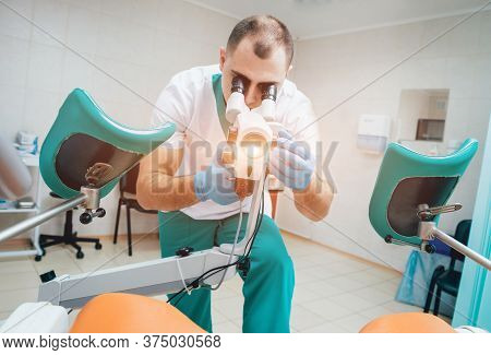 Gynecologist Working With Colposcope In Clinic. Medical
