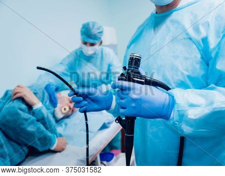 Endoscopy At The Hospital. Doctor Holding Endoscope Before Gastroscopy