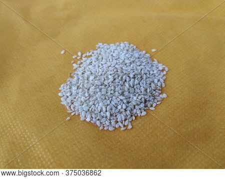 Pile And Heap Of A White Sesame Or Gingili Seeds. Texture And Backdrop