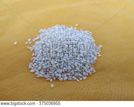 Pile And Heap Of A White Sesame Or Gingili Seeds. Texture And Backdrop