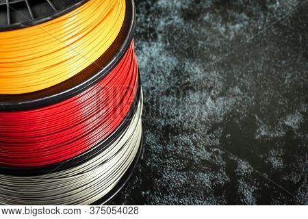 Filament For 3d Printing. Bright Thermoplastic Of Neon Orange, Color. Reel Horizontal View. Macro