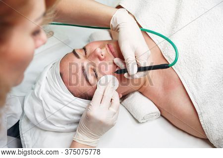 Woman Dermatologist Surgeon Preparing A Professional Electrocautery