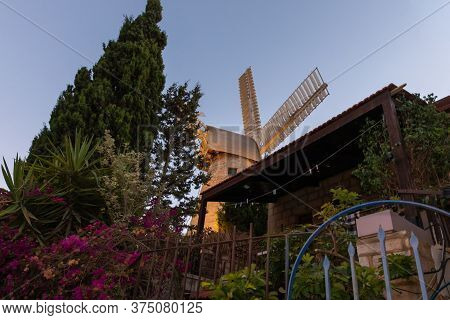 Jerusalem, Israel, June 26, 2020 : The Famous Montefiore Windmill Built In 1857, Now With Neighborho