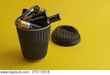 Kiev, Urkaine, 16 June 2020, Closeup At Duracell Aa Alkaline Batteries In Takeaway Coffee Cup As Ass