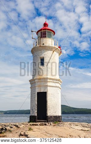 Lighthouse Tokarevskiy Egersheld On Tokarevskaya Koshka Cape In Vladivostok, Primorsky Krai In Russi