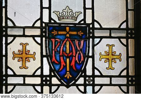St. Cloud Mn, Usa - July 3, 2020. Stained Glass Window With The Latin \