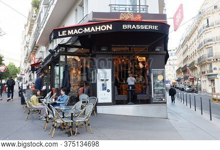 Paris, France - June 29 , 2020 : View Of Traditional French Brasserie Le Mac Mahon . It Located Near