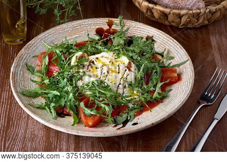 Closeup Italian Buratta Salad With Pesto And Tomato