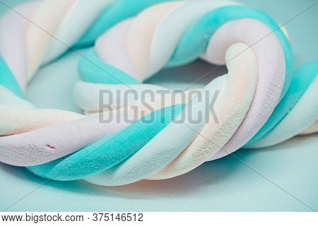 White And Blue Marshmallow On The White Background
