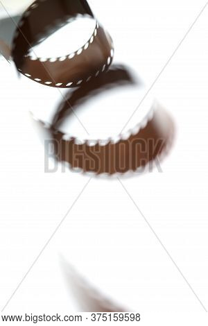 Two Coils Of Unprocessed Photographic Film On A Light Box