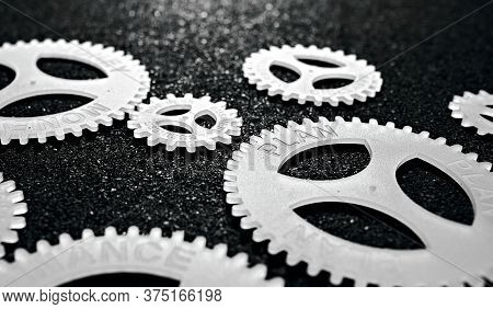 Several Gears With Different Inscription. Topic Of Finance. In Focus Plan Business