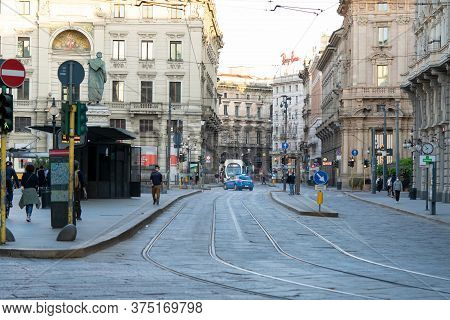 Milan, Italy - May 4, 2020: People Walk The Streets Of The City Wearing Face Mask. Tram Stop. Police