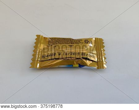 Closeup Of Front And Back View Of The Vicks Ginger Cough Drops 2.0G Candy Pack Isolated On White Bac