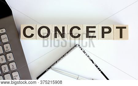 Business Concept Text On Wood Block Concept With Laptor And Notebook