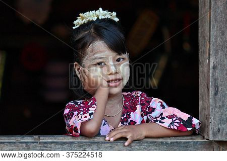Bagan, Myanmar - Nov 14, 2019: Burmese Girl Looking Out Of Window In Bagan, Myanmar Former Burma In 