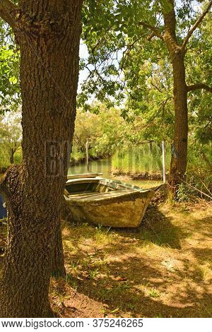An Old Wooden Fishing Boat In The Wetland Area Of Isola Della Cona In Friuli-venezia Giulia, North E