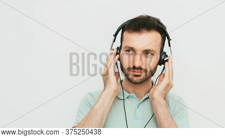 Mixed Race Man Getting A Hearing Test, Audiometer Hearing Test. On Grey Background