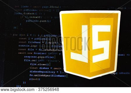 Moscow, Russia - 1 June 2020: Javascript Js Logo Sign With Program Code On Background Illustrative E