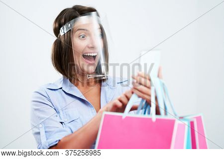 Attractive woman wearing protective shield isolated over white background