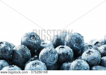 Tasty Blueberries Fruit Are Scattered On A White Background.