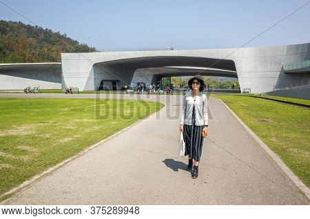 traveling woman walk at Xiangshan Visitor Center, Sun Moon Lake, Nantou, Taiwan
