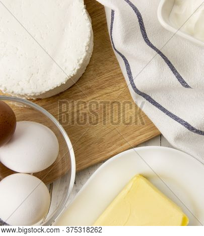 Dairy Products On Wooden Background, Top View