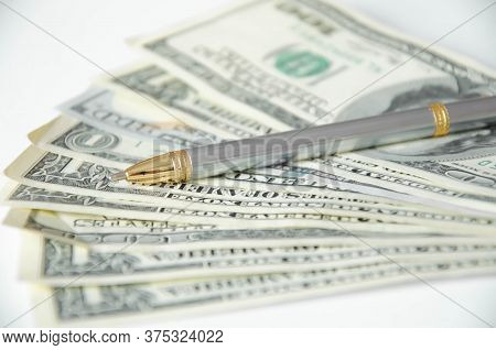 The Pen Lies On A White Background And Money. Tuition Fee. Financing
