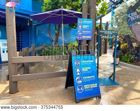 Orlando, Fl/usa-7/3/20: The Signs Explaining Face Masks And Social Distancing Rules At The  Entrance
