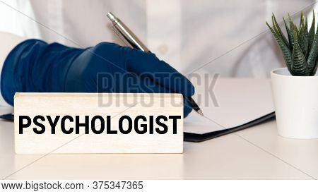Over The Shoulder View, Of A Business Man Sit On A Couch Talking To His Psychiatrist
