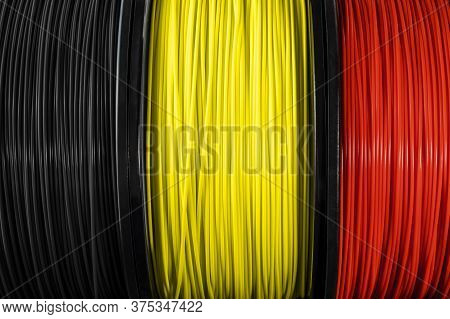 Belguim Flag Of The Coils For 3d Printer. Filament For 3d Printing, Bright Thermoplastic Of Black, Y