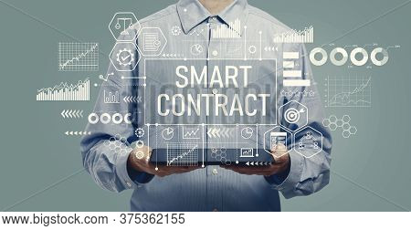 Smart Contract Concept With Young Man Holding A Tablet Computer