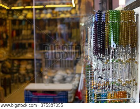 Rosary Hanging On Counter. Assortment Of Different Colors. Symbolizes Islamic Culture. Close Up.