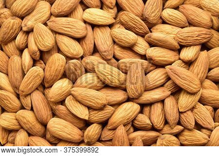 Top View Of Almond Background Texture. Healthy Snack And Food.  Almonds Top View.