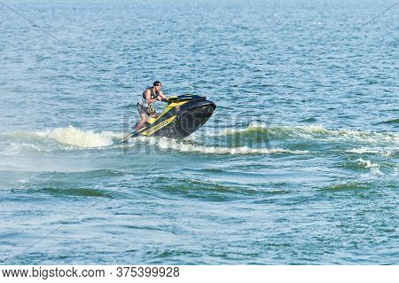 Voronezh, Russia - 23.08.2019 - Man On Water Scooter. Summer Vacation On Personal Watercraft In Trop