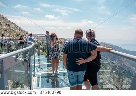 Biokovo, Croatia July 2020
An Older Tourist Couple Getting Their Photo Taken On The Newly Constructe