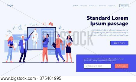 Senior Professor Lecturing Students Group In Classroom. Grey Haired Doctor Pointing At Body Silhouet