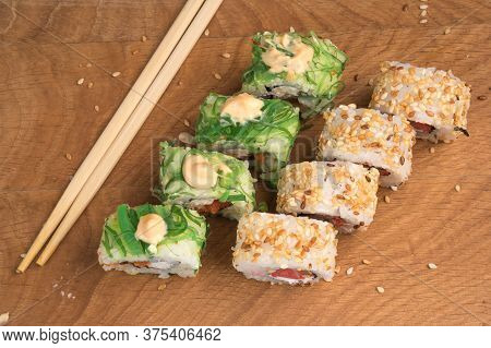 Sushi Rolls On A Wooden Board Delicious Food