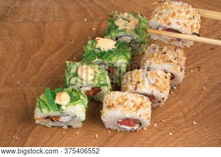 Sushi Rolls On A Wooden Board Delicious Food