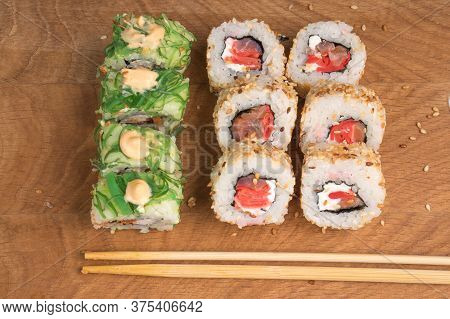 Sushi Rolls On A Wooden Board Delicious Food
