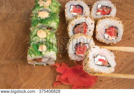 Sushi Rolls On A Wooden Board Delicious Food